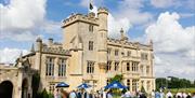 Exterior of Farleigh House, people gathered in the Garden