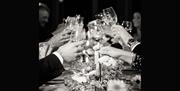 Group raising a toast at a meal