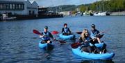 People kayaking in Bristol harbour