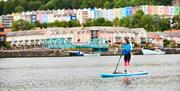 Person paddleboarding in Bristol