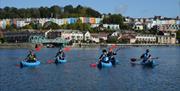 People kayaking in Bristol harbour