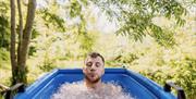 Ice bath in woods