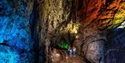 Family in illuminated Wookey Hole Caves - Caves near Bristol and Bath
