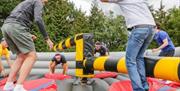 People playing on inflatable game