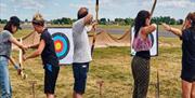 People participating in Archery