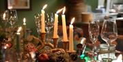 Candles and christmas directions on table