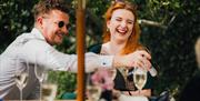 Summer party guests having drinks outside