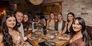 Group photograph of guests seated at table