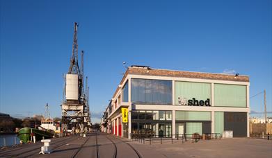 M Shed Museum with a blue sky.