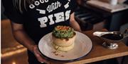 Pieminister - Waitress serving pie 

