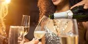 Christmas Parties at Bowood Hotel, Spa & Golf Resort - pouring champagne