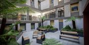 Courtyard area with seating and greenery