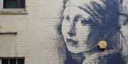 Banksy's Girl With The Pierced Eardrum in Bristol