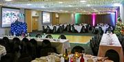 tables laid out for christmas party in function room