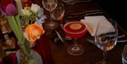 Table set with cocktails, flowers and decor
