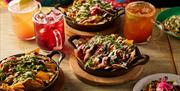 Cocktails and fully loaded nachos