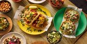 Tacos on colourful plates